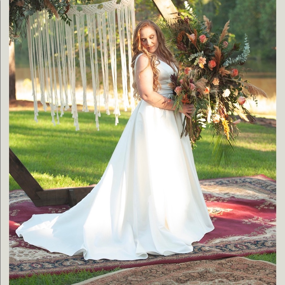 David’s bridal wedding dress, ivory satin ball gown with pockets.